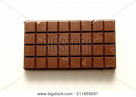 Chocolate bar background / A chocolate bar is a chocolate confection in an oblong or rectangular form, which distinguishes it from bulk chocolate produced for commercial use or individually portioned chocolates