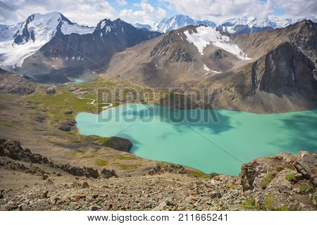 Nice lake and clouds in mountains of Kyrgyzstan