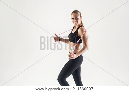 Healthy Lifestyle. Young Adult Blonde Caucasian Girl Holding A Rope.