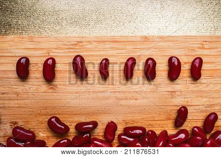 Red Beans Spread Out On A Wooden Cutting Board