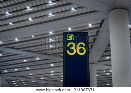 Airport arrival area baggage claim number sign board in departure area
