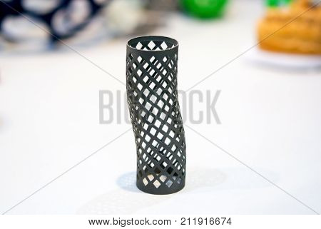 Object printed on metal 3d printer isolated on white background close-up. A model created in a laser sintering machine close-up. DMLS, SLM, SLS technology. Progressive modern additive technology.