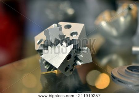 Object printed on metal 3d printer. A model created in a laser sintering machine close-up. DMLS, SLM, SLS technology. Concept of 4.0 industrial revolution. Progressive modern additive technology.