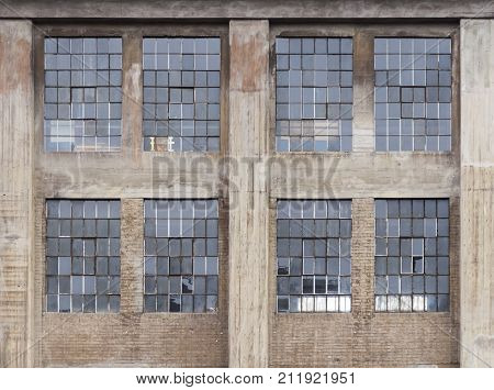 weathered industrial building detail with old rundown windows