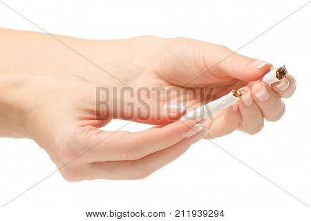 Broken cigarettes stop female hand on white background isolation