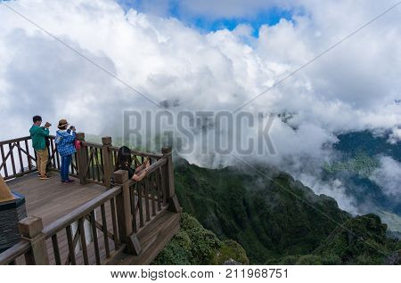 Tourists Enjoying The View From Observation Deck On Fansipan Mountain Summit