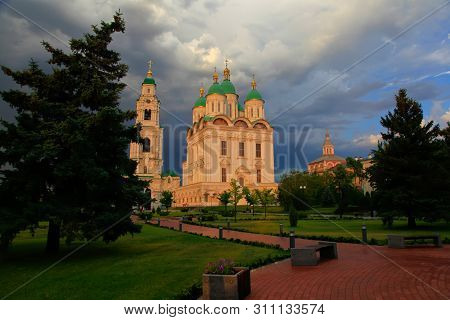 Astrakhan. Cathedral Of The Assumption Of The Blessed Virgin Mary. Golden Domes On A Background Of T