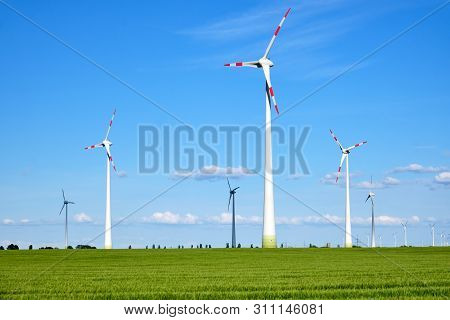 Wind Turbines In An Agricultural Field Seen In Germany