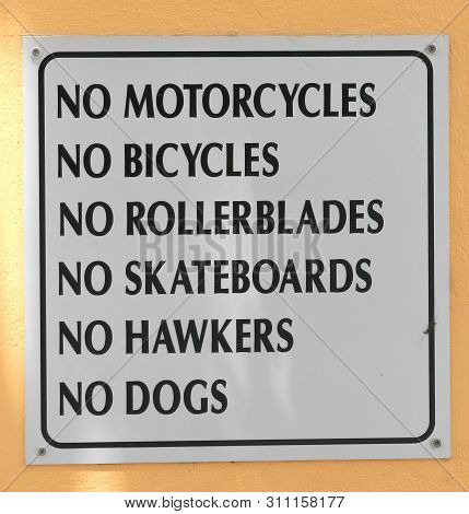 Sign Saying No Bikes, Rollerblades, Dogs, Close Up Outdoors