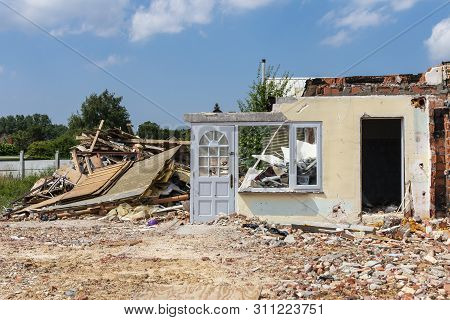 Sint Gillis Waas, Belgium, 11 July 2019, Old House For A Part Broken Off, The Front Door Is Still St