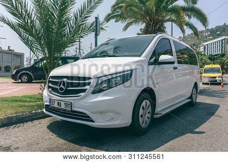 TURKEY, ALANIA -JULY 23, 2018 : Modern White Passenger Van on the Parking Lot