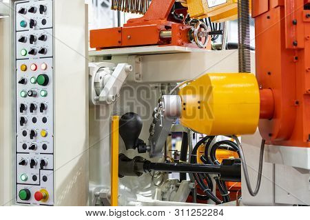 Close Up Ladle And Mechanical Arm Of High Pressure Aluminum Die Cast Machine And Other Detail During