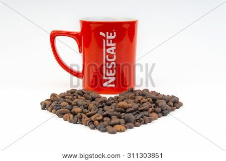 Kuala Lumpur, Malaysia - July 03, 2019:  Promotional Red Nescafe Mug On White Background. Selective 