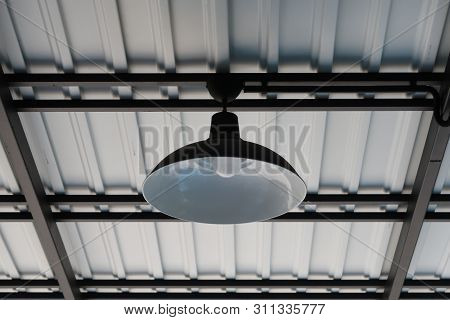 Black Coated Lamp Installed Under Metal Roof