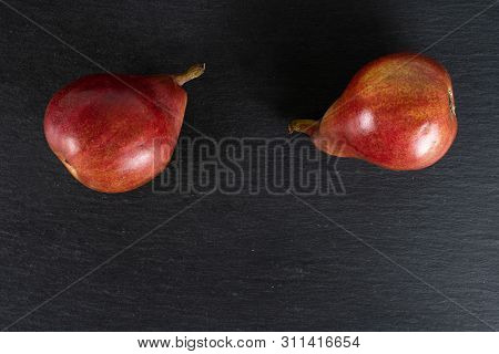 Group Of Two Whole Fresh Dark Red Pear Anjou Flatlay On Grey Stone