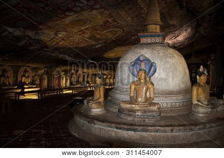 Dambulla, Sri Lanka - April 09, 2017: Statues Of Buddha In The Ancient Dambulla Cave Temple. Sri Lan