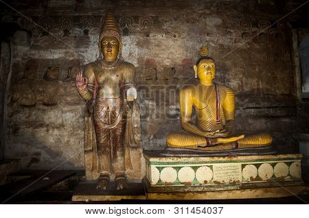 Dambulla, Sri Lanka - April 09, 2017: Statues Of Buddha In The Ancient Dambulla Cave Temple. Sri Lan