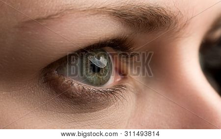 Closeup Of Amazing Female Emerald Green Coloured Right Eye With A Tiny Bit Of Makeup Cosmetics Aroun