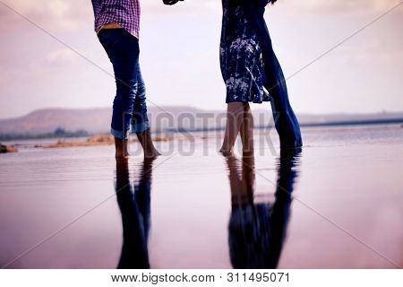 Looking At Each Other While Standing In Water During Prewedding Shoot, Is A Romantic Move