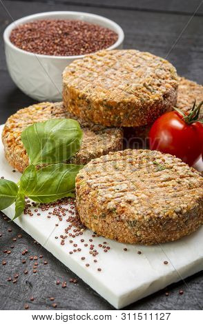 Tasty Vegetarian Burgers Made From Healthy Quinoa, Basil, Tomatoes And Mozzarella Cheese