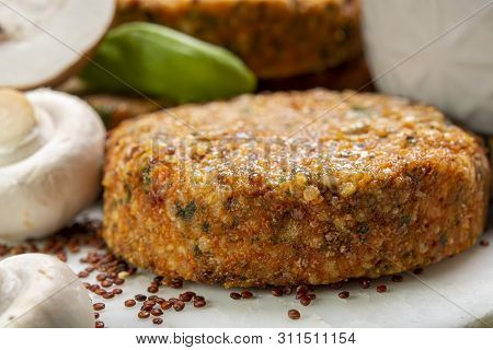 Tasty Vegetarian And Vegan Burgers Made From Healthy Quinoa, Basil, Tomatoes And Champignon Mushroom