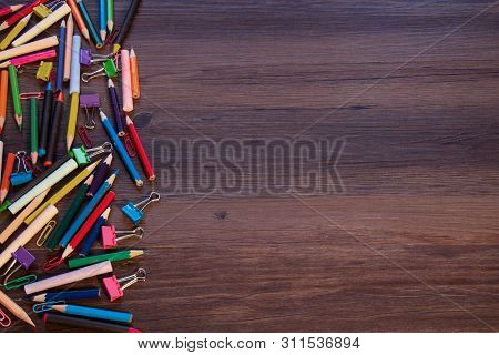 Background With With Pencils, Crayons, Paper Clips And Clips