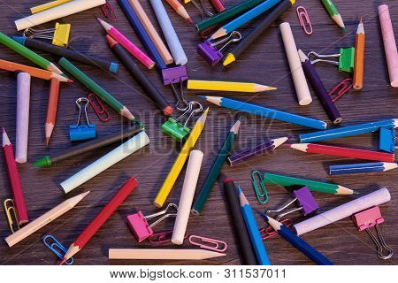 Smoothly Filled Background With Pencils, Crayons, Paper Clips And Clips