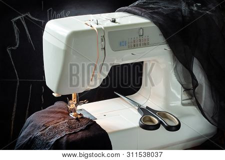 Sewing Black Knitted Dress In The Process