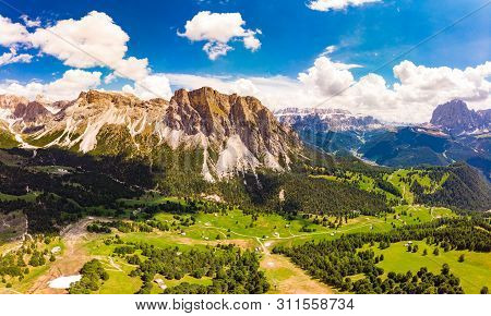 Aerial Top View From Drone To Col Raiser Plateau In Sunny Summer Day. Scenery Of Rugged Sella Mounta