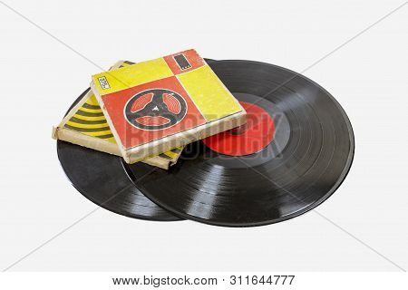 Old Musical Vinyl Records And Babin With Magnetic Tape Isolated On White Background