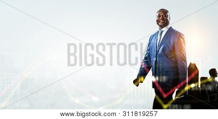 Black smiling businessman and white thoughtful businessman and a scyscraper