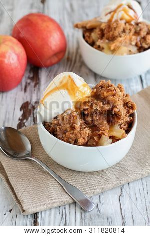 Fresh Hot Homemade Apple Crisp Or Crumble With Crunchy Streusel Topping Topped With Vanilla Bean Ice