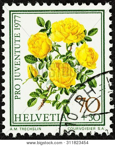 Seattle Washington - June 24, 2019: Close Up Of 1977 Pro Juventute Swiss Stamp Featuring Bright Yell