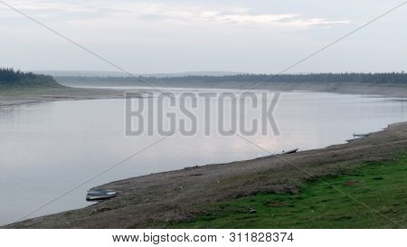 Parking Of Boats And Boats In The Wild North Of Yakutia On The Turn Of The Vilyui River In The Eveni