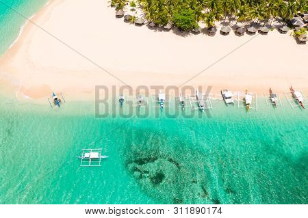 Beautiful Tropical Island In Sunny Weather, View From Above. Daco Island, Philippines. White Sandy B