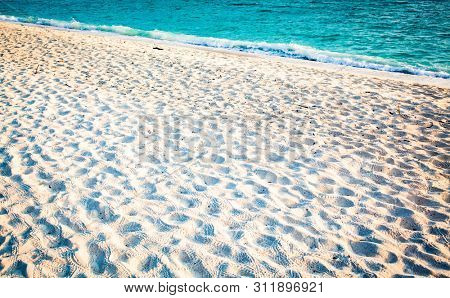 fine sand and clear blue water - beach background