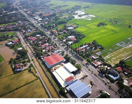 Aerial view of Kangar Town with paddy fields and housing area
