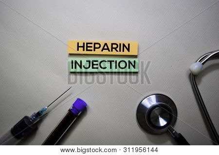 Heparin Injection Text On Sticky Notes. Top View Isolated On Office Desk. Healthcare/medical Concept