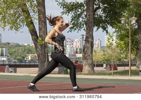 Fit Woman Exercising Outdoors, Healthy Lifestyle And Exercise Concept.