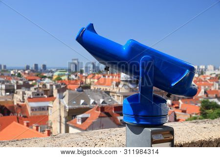 Zagreb City In Croatia. Summer Cityscape With Tourist Binoculars At A Viewpoint.