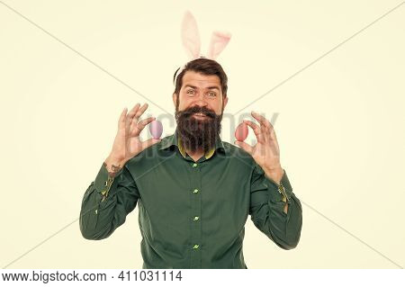 Eggs Are Dearest At Easter. Easter Bunny Delivering Colored Eggs. Bearded Man Hold Easter Eggs. Hips