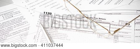 U.s. Individual Income Tax Return. Tax Form 1040 With Eyeglasses And Pen