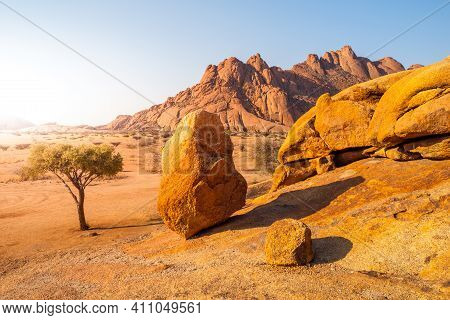 Pontok Mountains Near Spitzkoppe. Red Vivid Granite Rock Formation In Namib Desert At Sunset Time, N