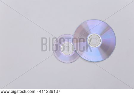 Compact Disсs On White Background. Top View