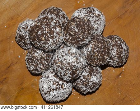 Coconut Ball Cakes On A Dish In The Dark