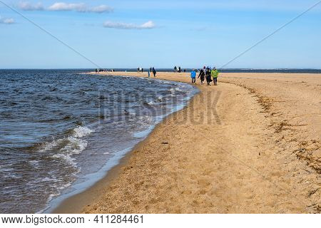 Rewa, Poland - March 6, 2021: People On The Beach In Rewa In Northern Poland. Rewa Is A Popular Tour