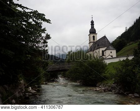 Idyllic Rural Alpine Mountain Chapel Parish Church St Sebastian At Ramsauer Ache River Stream In Ram
