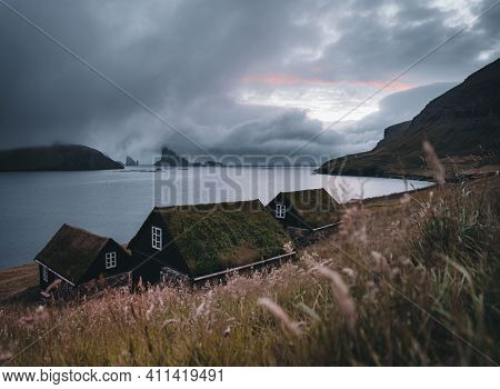 Bour Village Grass-covered Picturesque Houses At The Faroese Coastline In The Village Bour With View