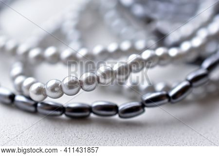 Beads Of Blue Beads On A White Background Costume Jewelry