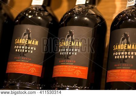 Porto, Portugal: Reserve Port Wine Bottles Sandeman Brand In Alcohol Store With Huge Choice Of Drink